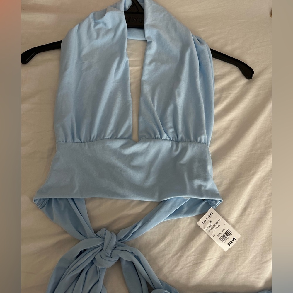 I am selling this blue top, ties around. Size Medium.